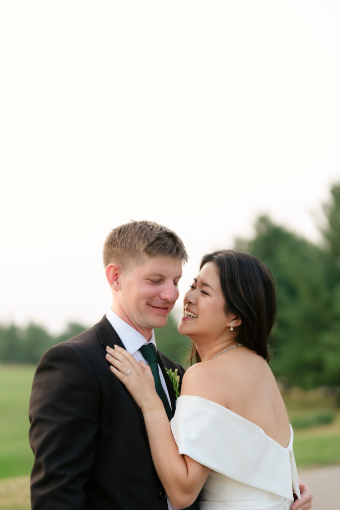 Anita and Scott holding hands during their outdoor ceremony at Cope Town Wood Golf Course Toronto wedding photographer