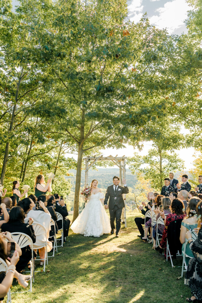 Wedding ceremony overlooking the valley at Glen Drummond Farm with 150 guests.