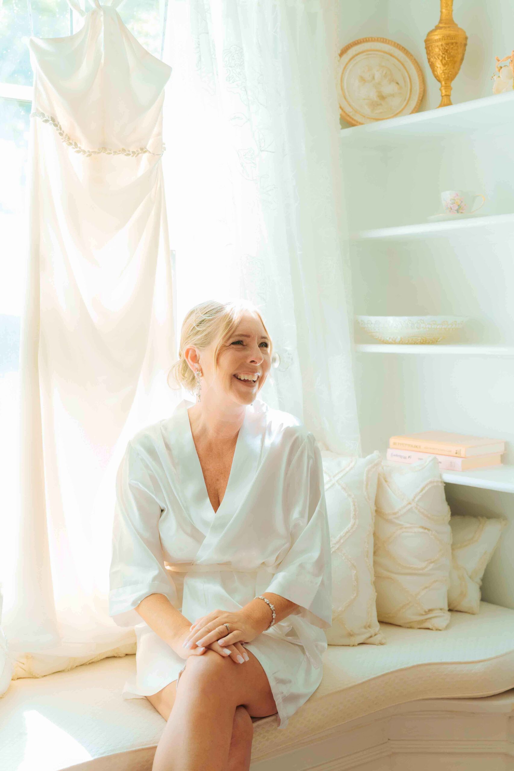 Bride getting ready at Paletta Mansion during a summer wedding in Hamilton, Ontario